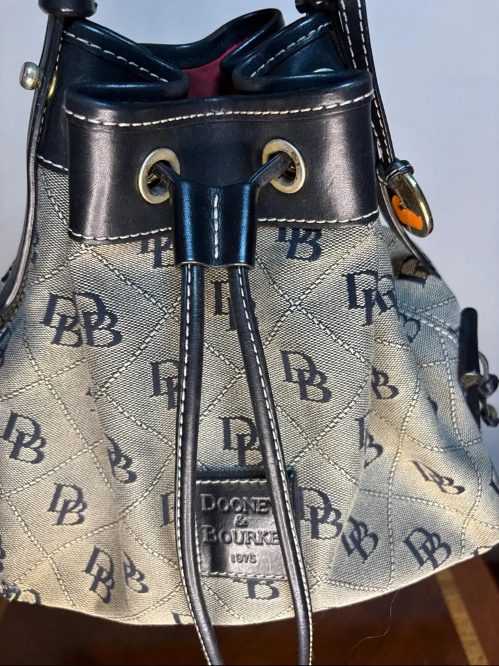 Dooney & Bourke Black Trim Signature Logo Drawstring Bucket Bag